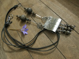 Sterling silver sheet and wire, leather lace, my own ceramic beads, turritella agate beads.