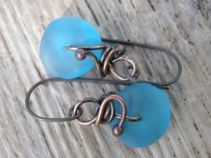 Sea glass, copper wire, titanium wire for the hooks.