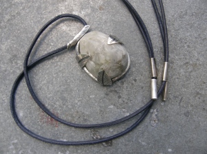 Stone cut by me, sterling silver, leather cord.