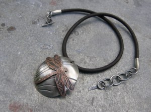 Patinated sterling silver and etched copper pendant, sterling silver closure, leather cord. waxed linen to fasten the pendant.