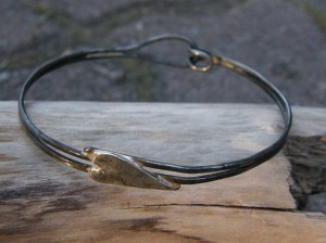 Iron wire and sterling silver heart.