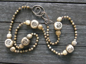 My ceramic beads, Picture Jasper, a few seed beads, on waxed linen cord, with my handmade bronze clasp.