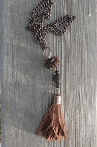 Tassel of recycled suede, handmade cap, wooden beads, handmade enamelled copper bead caps, copper wire, copper chain.
